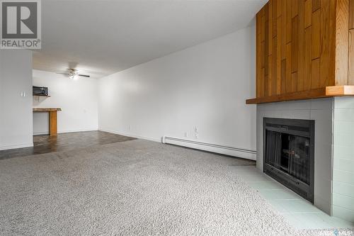 738 310 Stillwater Drive, Saskatoon, SK - Indoor Photo Showing Other Room With Fireplace