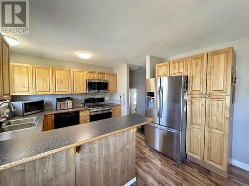 344-352 Seyforth Drive, Vanderhoof, BC - Indoor Photo Showing Kitchen With Double Sink