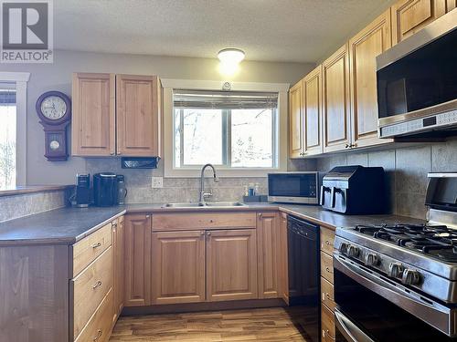 344-352 Seyforth Drive, Vanderhoof, BC - Indoor Photo Showing Kitchen With Double Sink