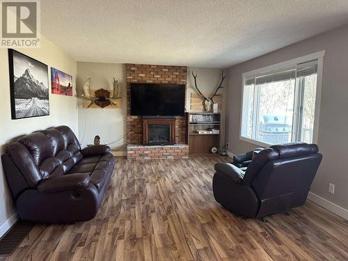 344-352 Seyforth Drive, Vanderhoof, BC - Indoor Photo Showing Living Room With Fireplace
