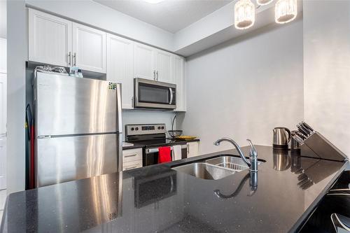 450 Dundas Street E|Unit #320, Waterdown, ON - Indoor Photo Showing Kitchen With Stainless Steel Kitchen With Double Sink