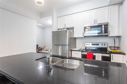 450 Dundas Street E|Unit #320, Waterdown, ON - Indoor Photo Showing Kitchen With Stainless Steel Kitchen With Double Sink