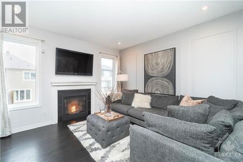 34 Escallonia Court, Ottawa, ON - Indoor Photo Showing Living Room With Fireplace