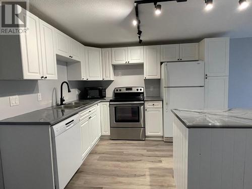 4423 E 53 Avenue, Fort Nelson, BC - Indoor Photo Showing Kitchen With Double Sink