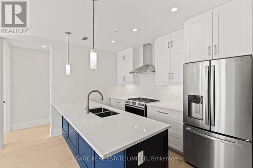 #607 -129 South St, Gananoque, ON - Indoor Photo Showing Kitchen With Double Sink With Upgraded Kitchen