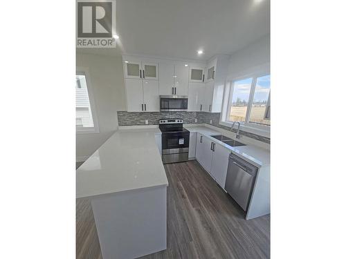 A 8323 79A Street, Fort St. John, BC - Indoor Photo Showing Kitchen With Double Sink