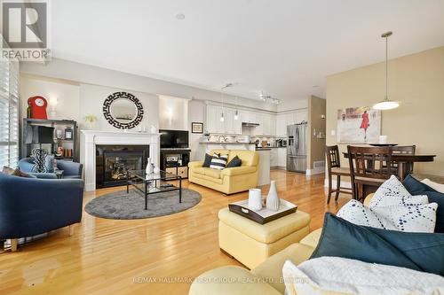 #102 -165 Division St, Cobourg, ON - Indoor Photo Showing Living Room With Fireplace