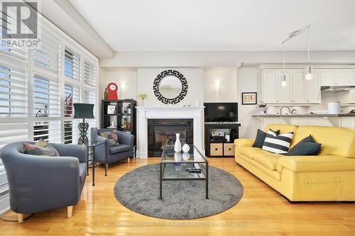 #102 -165 Division St, Cobourg, ON - Indoor Photo Showing Living Room With Fireplace