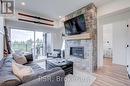 #207 -10 Beckwith Lane, Blue Mountains, ON  - Indoor Photo Showing Living Room With Fireplace 
