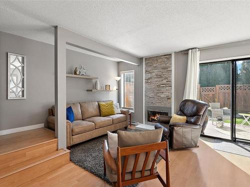 407-642 Agnes St, Saanich, BC - Indoor Photo Showing Living Room With Fireplace