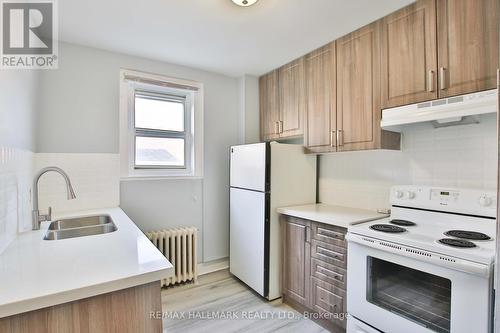 1563/65 Kingston Rd, Toronto, ON - Indoor Photo Showing Kitchen With Double Sink