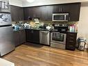 #1515 -1 De Boers Dr, Toronto, ON  - Indoor Photo Showing Kitchen With Stainless Steel Kitchen With Double Sink With Upgraded Kitchen 