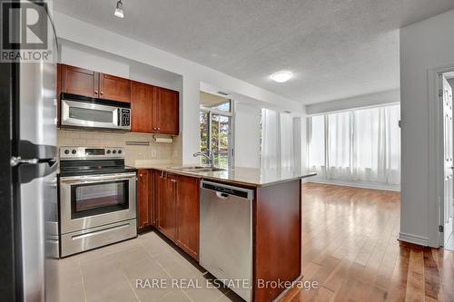 207 - 3504 Hurontario Street, Mississauga, ON - Indoor Photo Showing Kitchen With Stainless Steel Kitchen With Double Sink