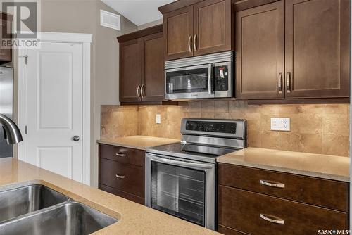 551 Rempel Manor, Saskatoon, SK - Indoor Photo Showing Kitchen With Double Sink