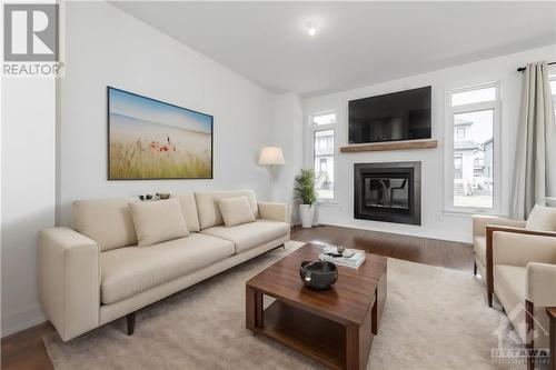 *virtually staged* - 90 Nettle Crescent, Ottawa, ON - Indoor Photo Showing Living Room With Fireplace