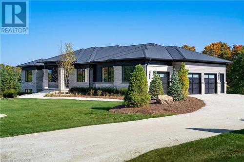 3 car garage at side - 147 Blue Jay Crescent, Grey Highlands, ON - Outdoor With Facade