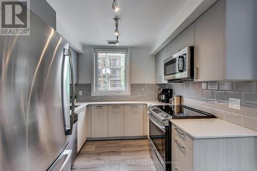 #208 -385 Osler St, Toronto, ON - Indoor Photo Showing Kitchen With Upgraded Kitchen