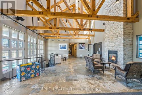 #165 -200 Kingfisher Dr, Mono, ON - Indoor With Fireplace