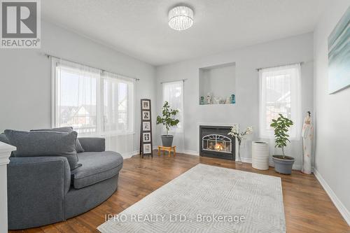 #165 -200 Kingfisher Dr, Mono, ON - Indoor Photo Showing Living Room With Fireplace