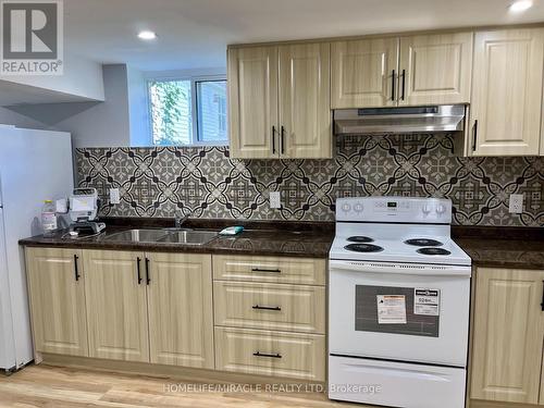 5659 Robinson Street, Niagara Falls, ON - Indoor Photo Showing Kitchen With Double Sink