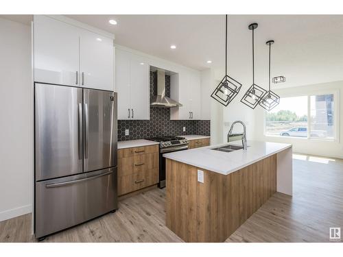 #Main 8082 Kiriak Li Sw, Edmonton, AB - Indoor Photo Showing Kitchen With Stainless Steel Kitchen With Double Sink With Upgraded Kitchen