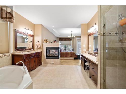 1297 Tanemura Crescent, Kelowna, BC - Indoor Photo Showing Bathroom With Fireplace