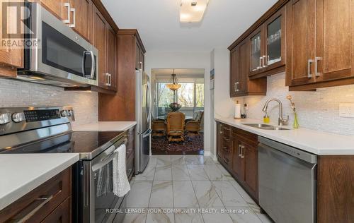 #306 -75 Wynford Heights Cres, Toronto, ON - Indoor Photo Showing Kitchen With Double Sink