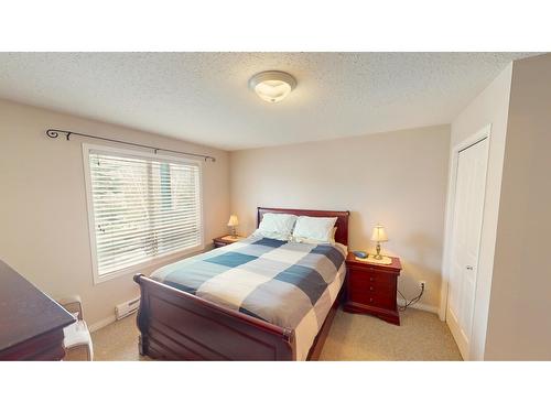 209 - 4769 Forsters Landing Road, Radium Hot Springs, BC - Indoor Photo Showing Bedroom