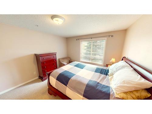 209 - 4769 Forsters Landing Road, Radium Hot Springs, BC - Indoor Photo Showing Bedroom