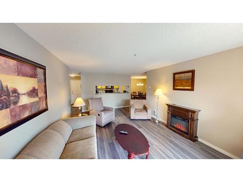 209 - 4769 Forsters Landing Road, Radium Hot Springs, BC - Indoor Photo Showing Living Room With Fireplace