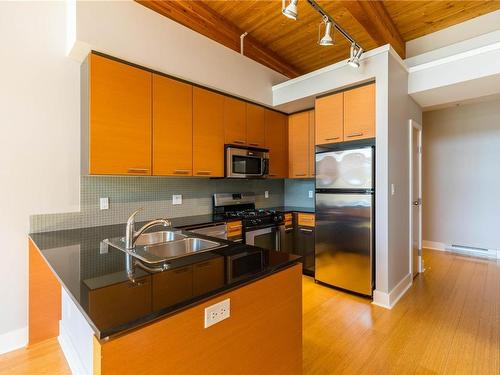 404-610 Johnson St, Victoria, BC - Indoor Photo Showing Kitchen With Stainless Steel Kitchen With Double Sink