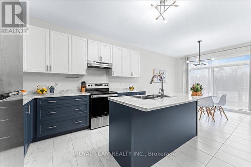 154 Ramblewood Drive, Wasaga Beach, ON - Indoor Photo Showing Kitchen With Double Sink With Upgraded Kitchen