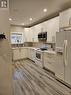 390 Cannon St E, Hamilton, ON  - Indoor Photo Showing Kitchen With Double Sink 