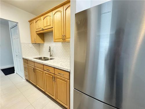657 Fennell Avenue E|Unit #2, Hamilton, ON - Indoor Photo Showing Kitchen With Double Sink
