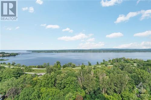 Picture taken from 22nd floor in same vertical plane in the building as unit 1404. Gives you an idea of how beautiful the Summer view is! - 1025 Richmond Road Unit#1404, Ottawa, ON - Outdoor With Body Of Water With View