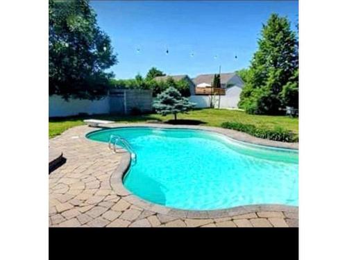 Piscine - 236 Rue Des Plaines, Les Coteaux, QC - Outdoor With In Ground Pool With Backyard