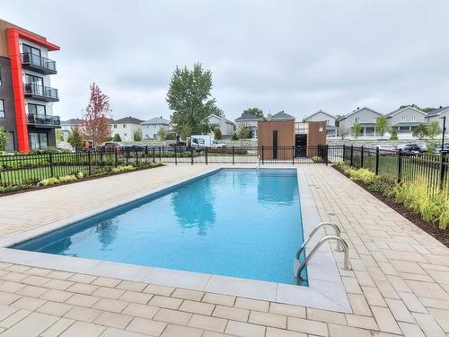 Pool - 404-3040 Rue De La Comtesse, Laval (Duvernay), QC - Outdoor With In Ground Pool