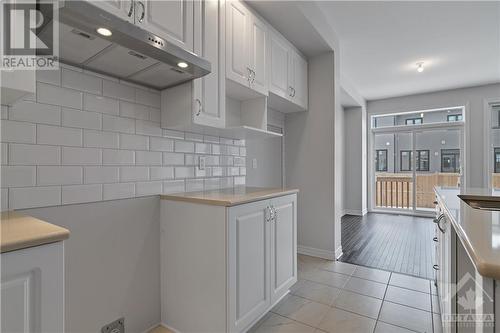 this is the same model at a different location, so finishes will vary.  NO rear neighbours at this location - 709 Maverick Crescent, Ottawa, ON - Indoor Photo Showing Kitchen