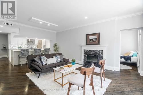 #202 -460 Wellington St, London, ON - Indoor Photo Showing Living Room With Fireplace