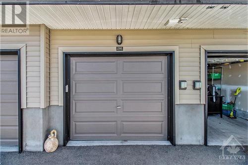 Garage + parking for an additional car. - 298 Pembina Private, Ottawa, ON - Outdoor With Exterior