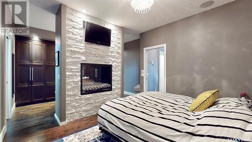 4613 Skinner Crescent, Regina, SK - Indoor Photo Showing Bedroom With Fireplace