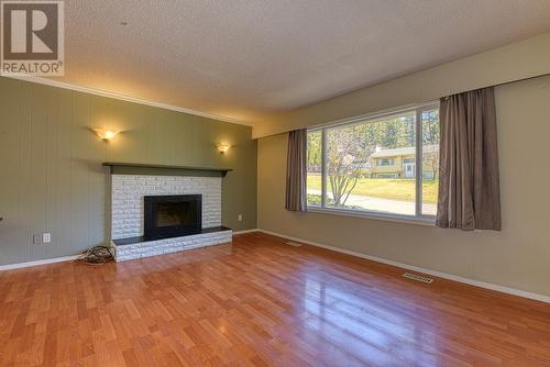 1295 N Eleventh Avenue, Williams Lake, BC - Indoor Photo Showing Living Room With Fireplace