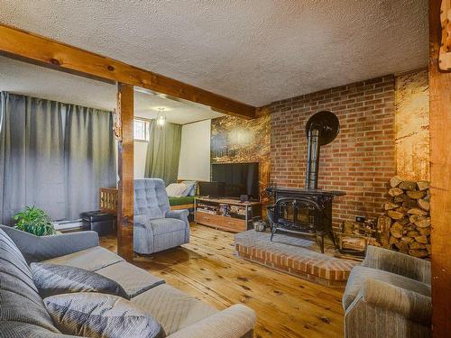 Salle familiale - 449 Ch. Birchwood, Saint-Sauveur, QC - Indoor Photo Showing Living Room With Fireplace