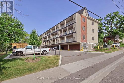 #101 -128 Barrie St, Bradford West Gwillimbury, ON - Outdoor With Balcony With Facade