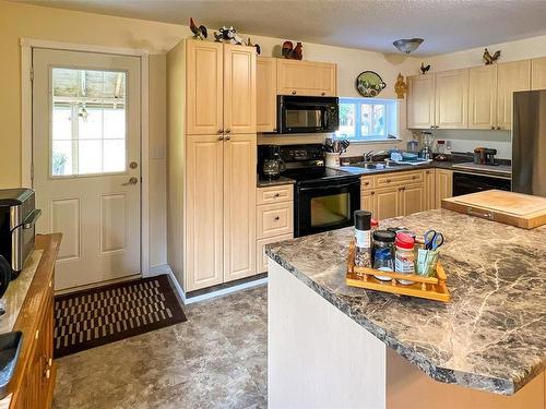 105 Springhill Rd, Port Mcneill, BC - Indoor Photo Showing Kitchen With Double Sink