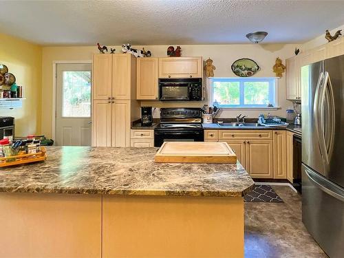 105 Springhill Rd, Port Mcneill, BC - Indoor Photo Showing Kitchen With Double Sink