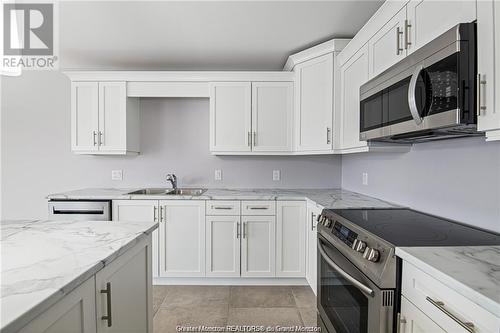 25 Rochefort St, Dieppe, NB - Indoor Photo Showing Kitchen With Double Sink