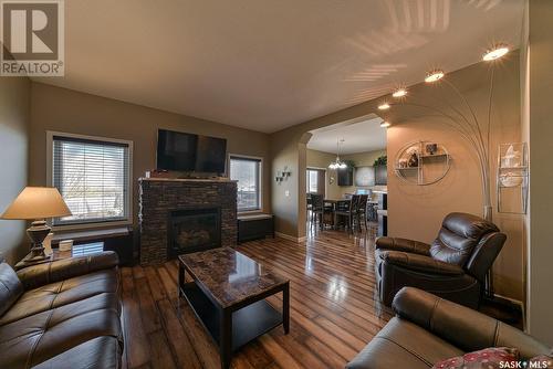 18 Mckenzie Landing, White City, SK - Indoor Photo Showing Living Room With Fireplace