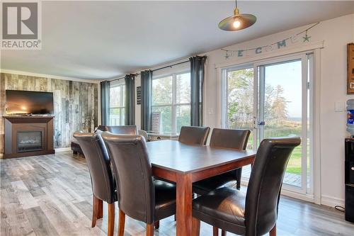 501 Johnson Point Road, Johnston Point, NB - Indoor Photo Showing Dining Room With Fireplace