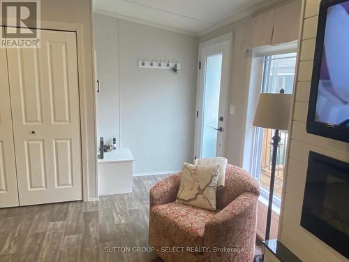 Main entrance with large coat closet - 55 - 22790 Amiens Road, Middlesex Centre (Komoka), ON - Indoor With Fireplace